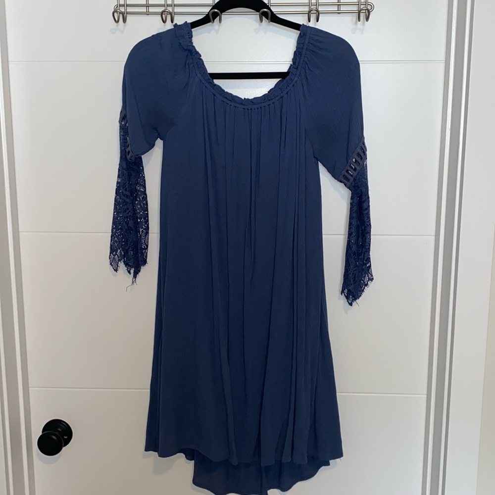 Long sleeve lace detailed lined dress.